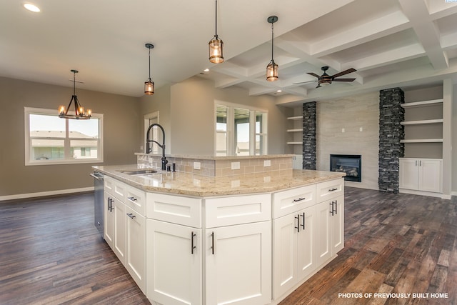 2989 Wild Canyon Way, Richland, WA 99354 - kitchen with pendant lighting, sink, a kitchen island with sink, coffered ceiling, and white cabinets