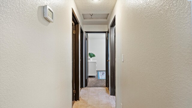 4745 W Robin Ct, West Richland, WA 99353 - hall featuring a textured wall and light tile patterned floors