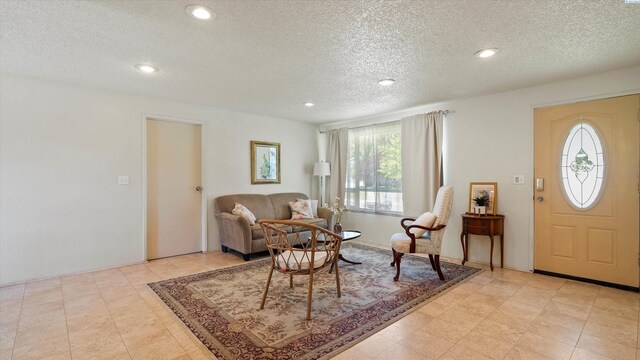 4745 W Robin Ct, West Richland, WA 99353 - living area featuring a textured ceiling and recessed lighting