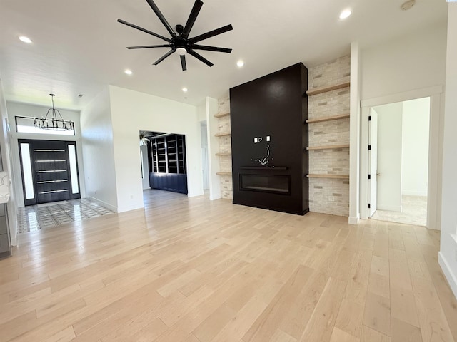 3408 Royce Ln, Pasco, WA 99301 - unfurnished living room with light wood finished floors, ceiling fan, recessed lighting, and a chandelier