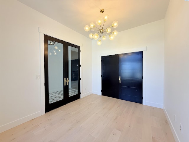 3408 Royce Ln, Pasco, WA 99301 - foyer with a chandelier, french doors, and light wood-style floors