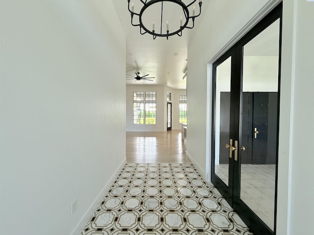 3408 Royce Ln, Pasco, WA 99301 - hallway with french doors and a chandelier