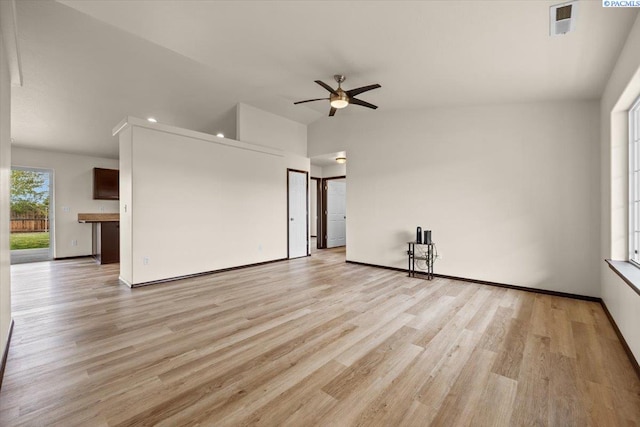 unfurnished living room featuring light wood-style floors, baseboards, ceiling fan, and visible vents