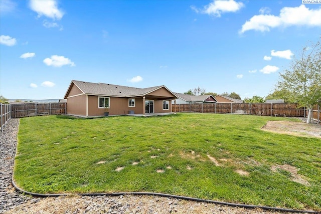 view of yard with a fenced backyard and a patio area