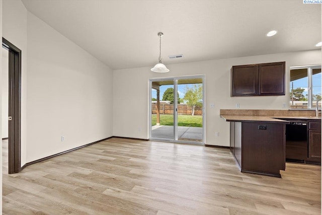 kitchen with dark brown cabinetry, visible vents, vaulted ceiling, light wood-type flooring, and dishwasher