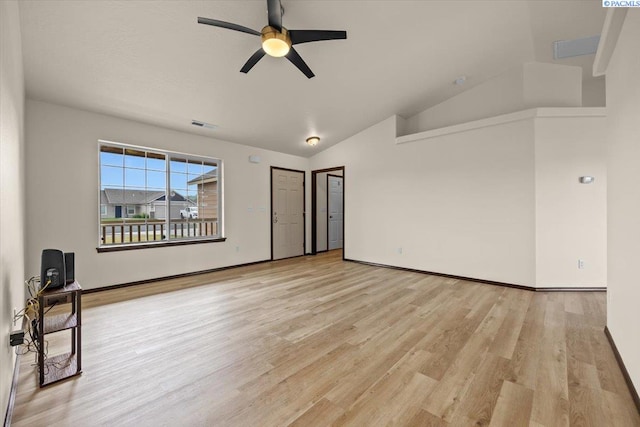 unfurnished room featuring visible vents, light wood-style floors, a ceiling fan, baseboards, and vaulted ceiling