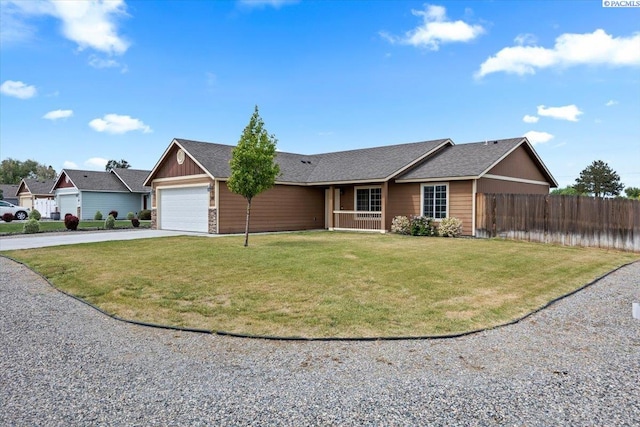 ranch-style house featuring a garage, a front lawn, fence, board and batten siding, and concrete driveway