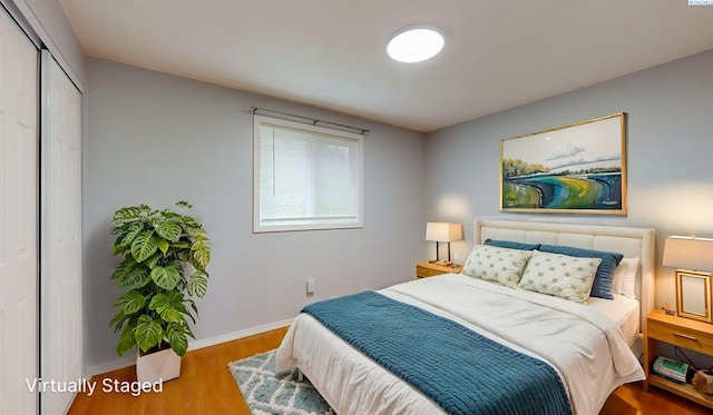 90 NW Thomas St Unit B, Pullman, WA 99163 - bedroom featuring wood finished floors, a closet, and baseboards
