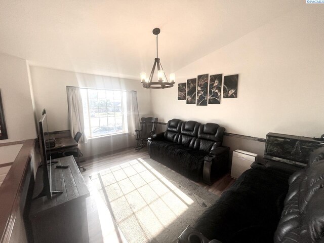 5019 Cambridge Ln, Pasco, WA 99301 - living area with a chandelier, wood finished floors, and vaulted ceiling
