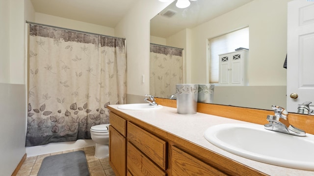 5019 Cambridge Ln, Pasco, WA 99301 - full bath with double vanity, tile patterned flooring, and a shower with curtain