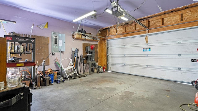 5019 Cambridge Ln, Pasco, WA 99301 - garage featuring electric panel and a garage door opener