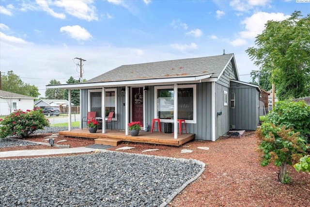 518 Wright Ave, Richland, WA 99352 - view of front facade featuring board and batten siding, covered porch, and a shingled roof