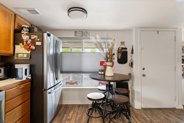 518 Wright Ave, Richland, WA 99352 - kitchen featuring healthy amount of natural light, baseboards, brown cabinets, and dark wood-style floors