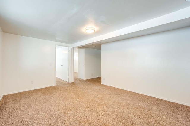 unfurnished room with light colored carpet