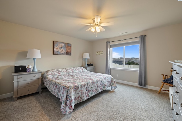 bedroom featuring ceiling fan and light carpet