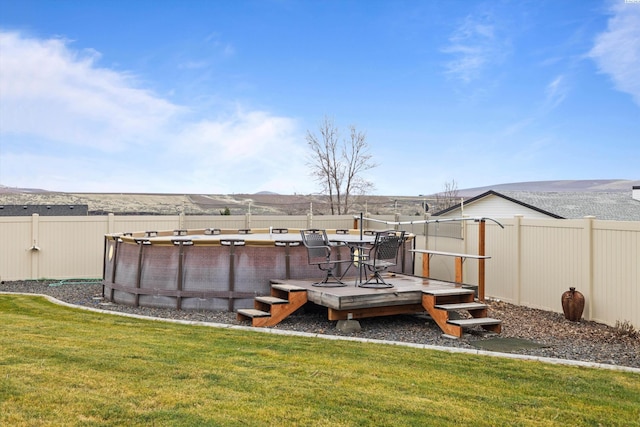 exterior space featuring a pool side deck with mountain view