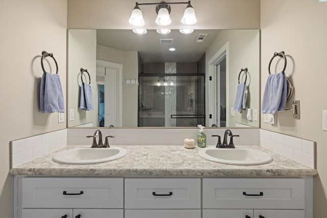 bathroom featuring vanity and walk in shower