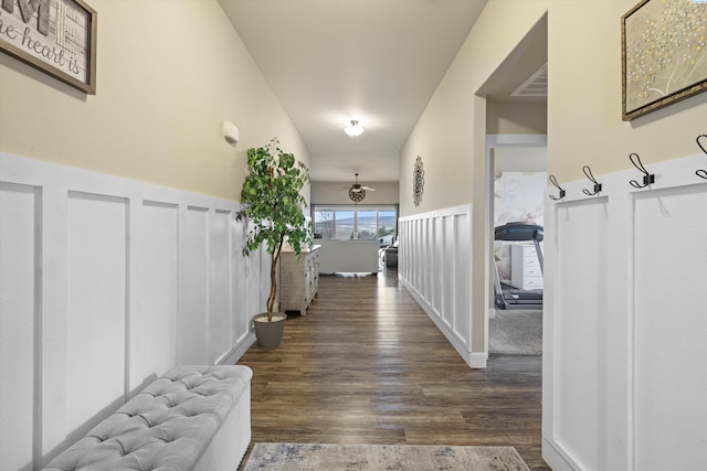 corridor with dark hardwood / wood-style flooring