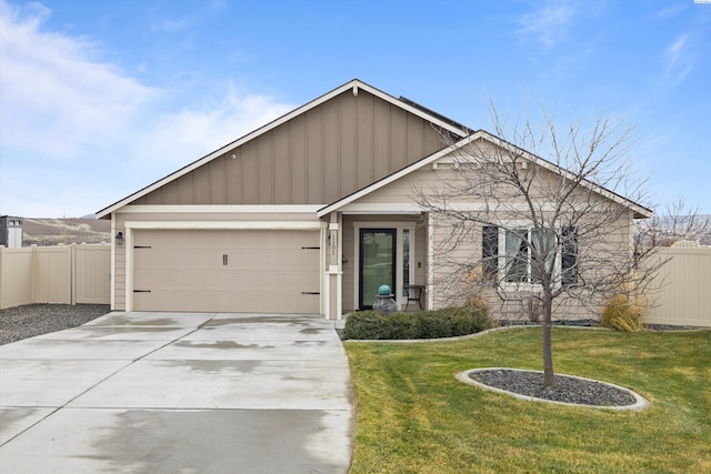 view of front of home featuring a garage and a front yard