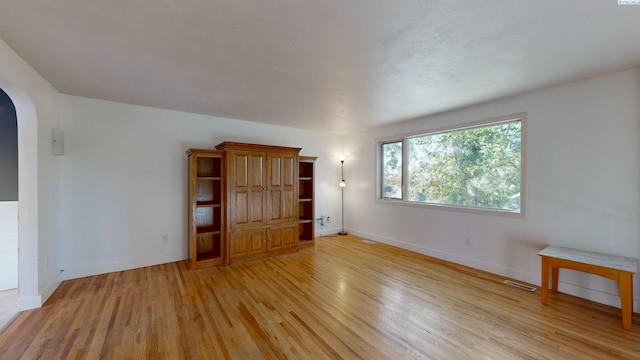 unfurnished living room featuring light hardwood / wood-style flooring