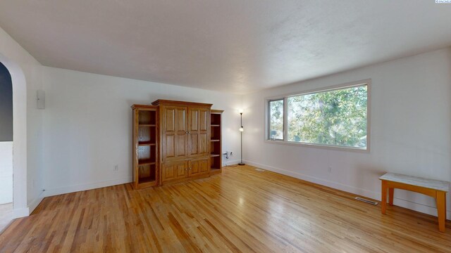 unfurnished living room featuring light hardwood / wood-style flooring