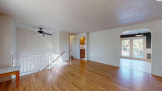 empty room featuring ceiling fan and light wood-type flooring