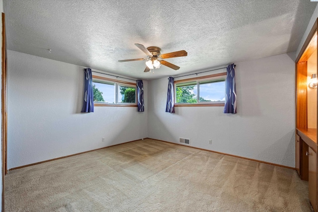 508 W Concord Ave, Grandview, WA 98930 - empty room featuring a ceiling fan, light carpet, and a textured ceiling
