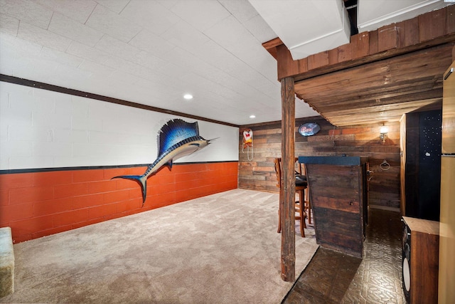 508 W Concord Ave, Grandview, WA 98930 - additional living space with wooden walls, carpet, concrete block wall, and a wainscoted wall