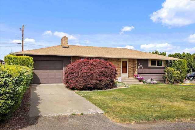 508 W Concord Ave, Grandview, WA 98930 - single story home with driveway, a front lawn, a garage, a chimney, and roof with shingles