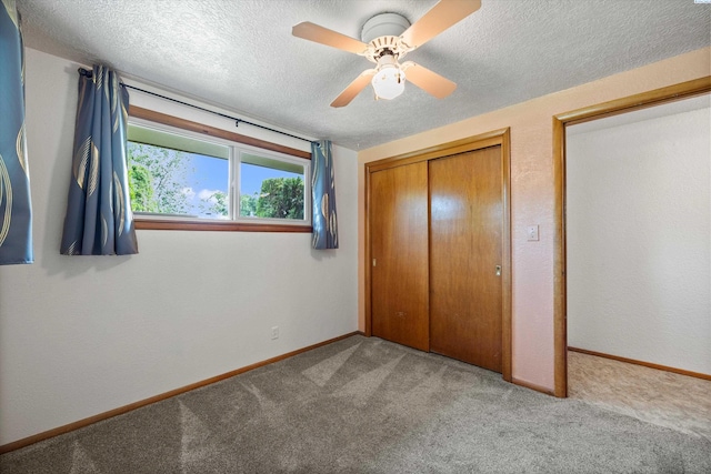 508 W Concord Ave, Grandview, WA 98930 - unfurnished bedroom with carpet flooring, a closet, a textured ceiling, and a ceiling fan