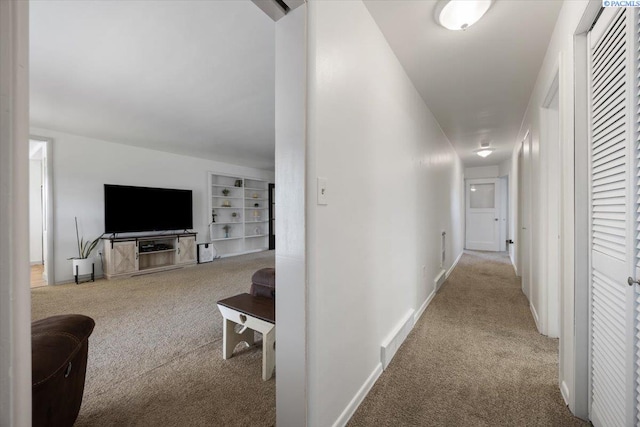 3700 Sheller Rd, Sunnyside, WA 98944 - hallway featuring carpet flooring, built in features, and baseboards