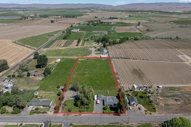 3700 Sheller Rd, Sunnyside, WA 98944 - aerial view of sparsely populated area featuring property boundaries highlighted, a mountain backdrop, and abundant farmland