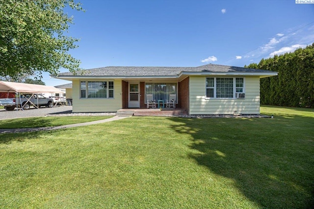 3700 Sheller Rd, Sunnyside, WA 98944 - ranch-style home with a porch and a front lawn
