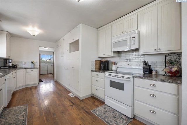 3700 Sheller Rd, Sunnyside, WA 98944 - kitchen featuring white appliances, backsplash, dark countertops, dark wood finished floors, and white cabinets