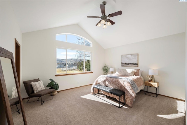 carpeted bedroom featuring high vaulted ceiling, a ceiling fan, and baseboards