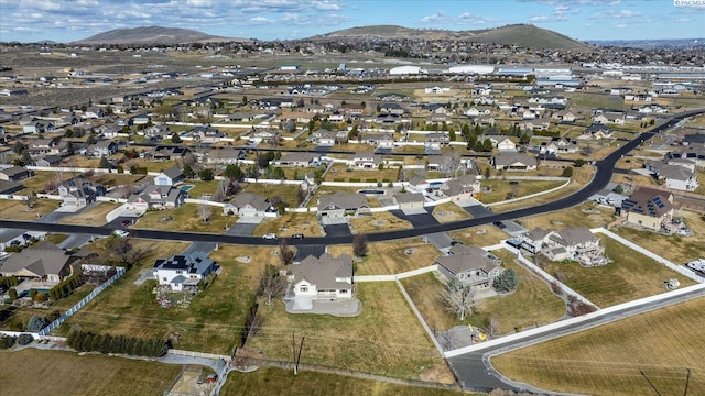 birds eye view of property with a residential view and a mountain view