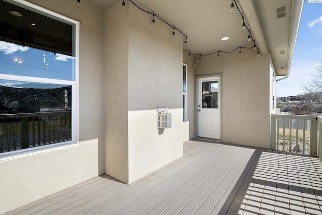 wooden deck with visible vents