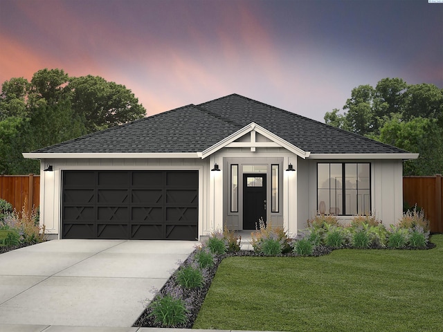 view of front of home featuring a yard, roof with shingles, fence, and driveway