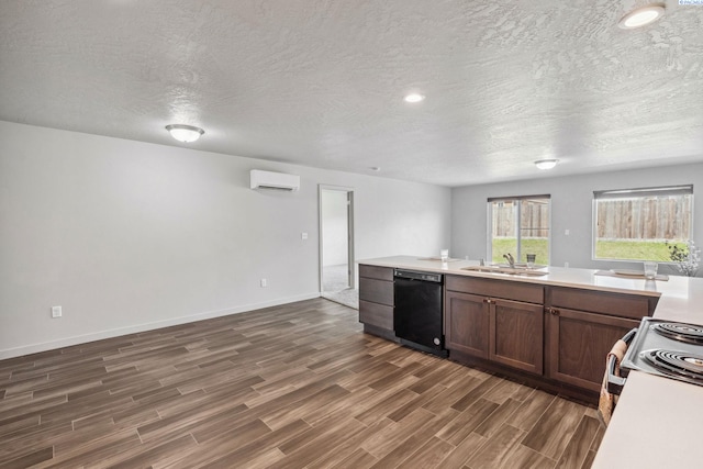407 Dawson Ln, Pasco, WA 99301 - kitchen with dishwasher, a wall mounted AC, a sink, dark wood-style floors, and light countertops