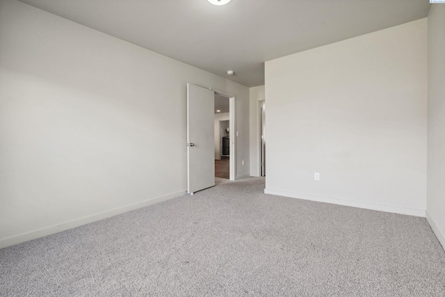 407 Dawson Ln, Pasco, WA 99301 - spare room with light carpet and baseboards