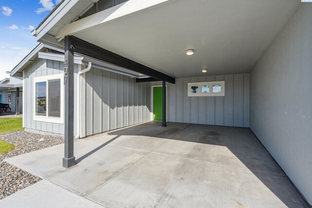 407 Dawson Ln, Pasco, WA 99301 - view of exterior entry featuring a carport and board and batten siding