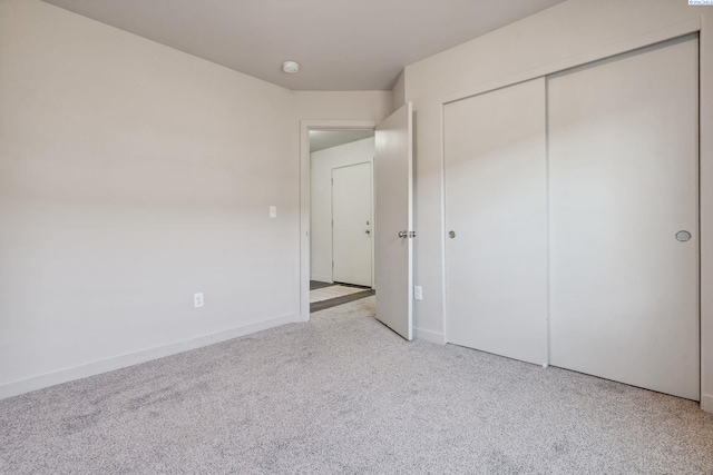 407 Dawson Ln, Pasco, WA 99301 - unfurnished bedroom featuring carpet floors, a closet, and baseboards
