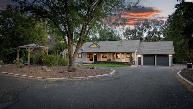 view of front of property with a gazebo and a garage