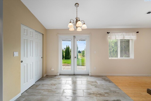 2704 Iris St, West Richland, WA 99353 - entryway featuring plenty of natural light, a chandelier, baseboards, and french doors
