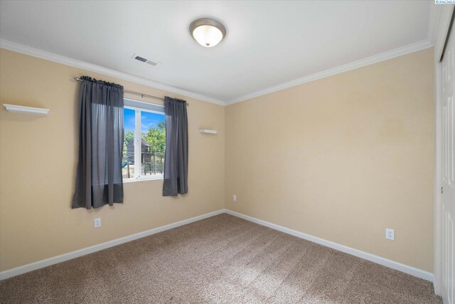 2704 Iris St, West Richland, WA 99353 - spare room featuring carpet floors, crown molding, and baseboards