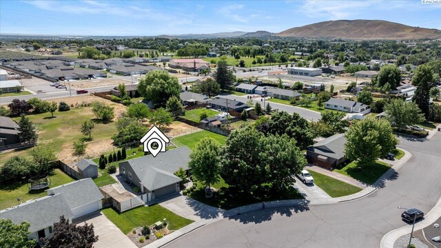 2704 Iris St, West Richland, WA 99353 - aerial perspective of suburban area featuring a mountain backdrop