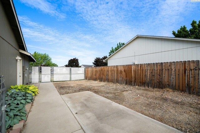 2704 Iris St, West Richland, WA 99353 - view of yard with a gate and a patio area