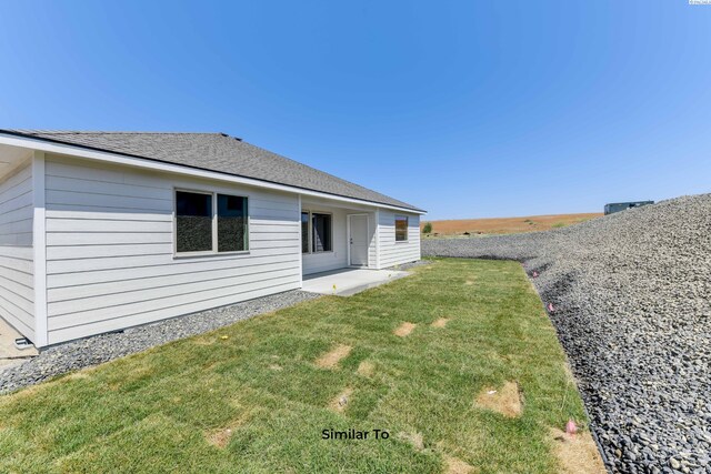 2945 S Penn St, Kennewick, WA 99338 - rear view of property with a lawn