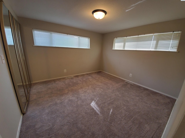 view of carpeted spare room