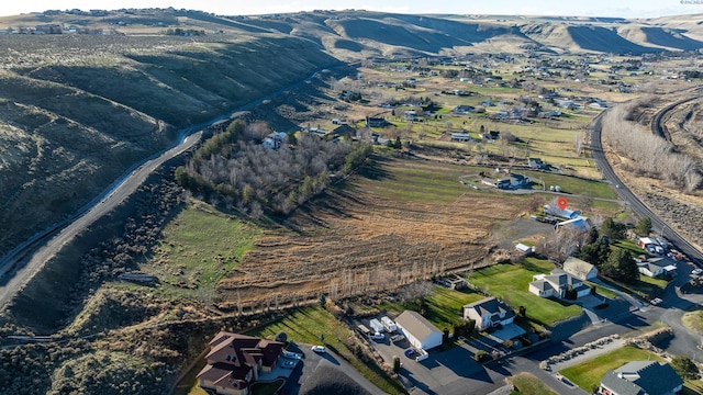 birds eye view of property with a mountain view